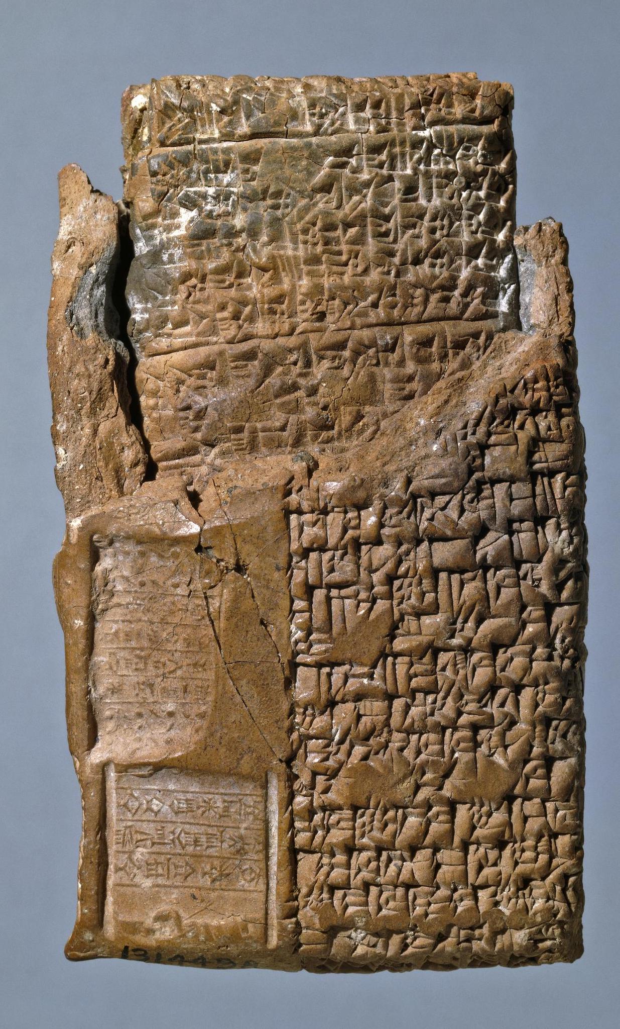 Cuneiform tablet still in its clay case: legal case from Niqmepuh, King of Iamhad (Aleppo), 1720 B.C.E., 3.94 x 2 inches (© Trustees of the British Museum)